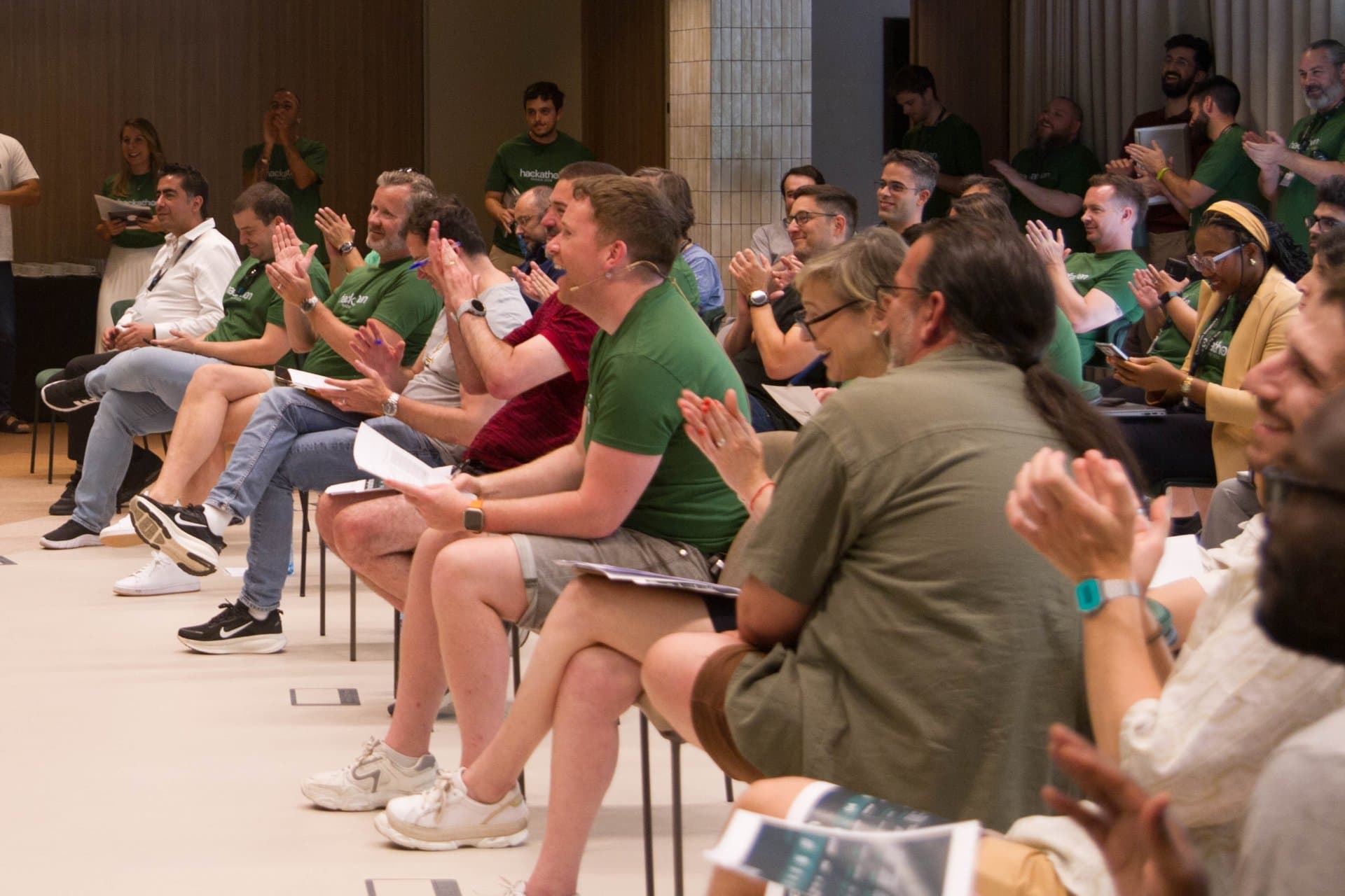 Eoin Greene, Chief Technology Officer at ESW clapping along with the other Hackathon judges.