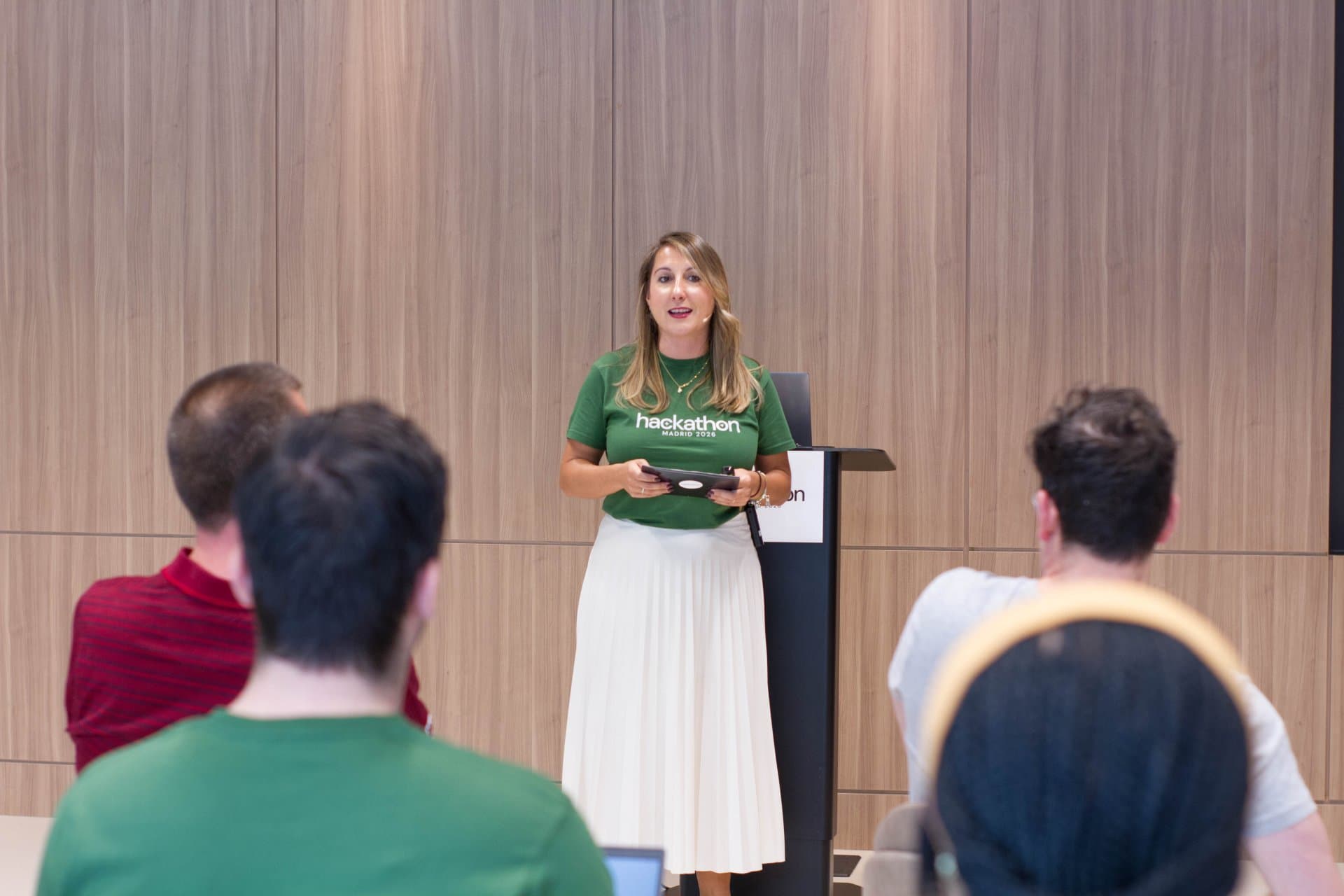 Picture of Pilar Sanchez (Project lead of ESW's Hackathon) speaking to the crowd.